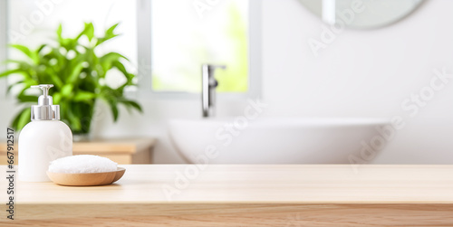 Empty tabletop for product display with blurred bathroom interior background. Soap dispenser and Spa towel on pastel bathroom window interior with plant