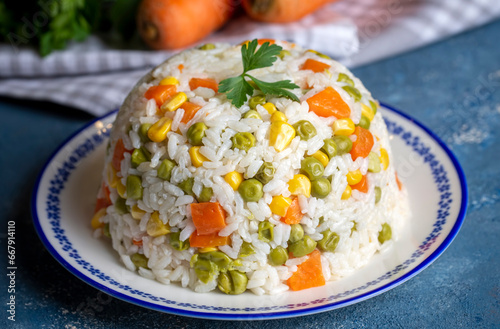 Delicious vegetable rice pilaf with green peas, carrots and sweet corn (Turkish name; sebzeli pilav) photo