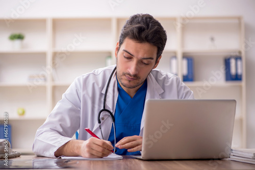 Young male doctor working in the clinic