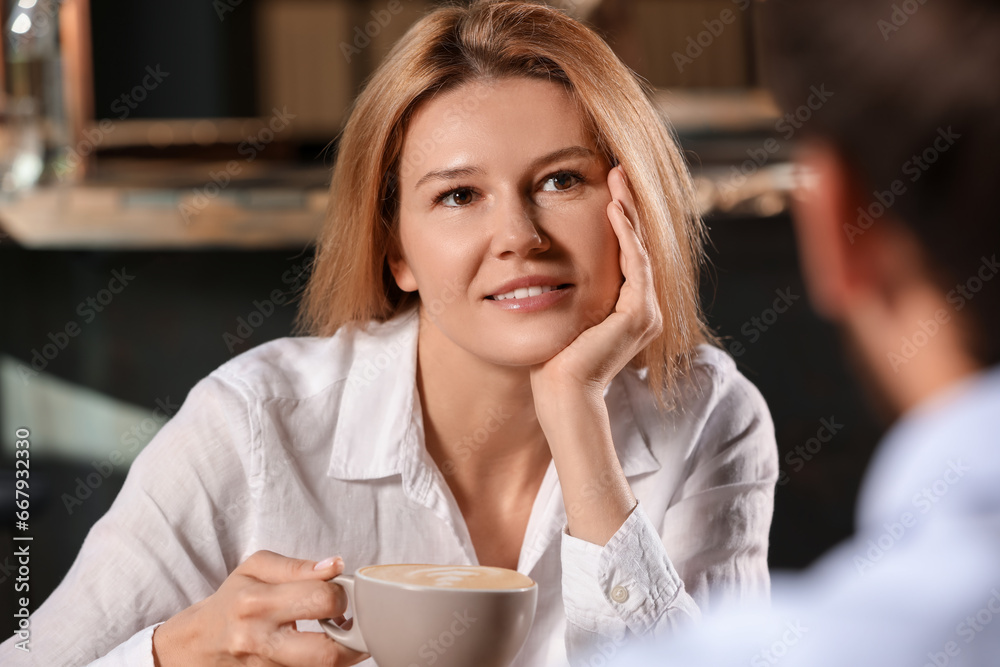 Romantic date. Happy couple spending time together in cafe Romantic date. Happy couple spending time together in cafe