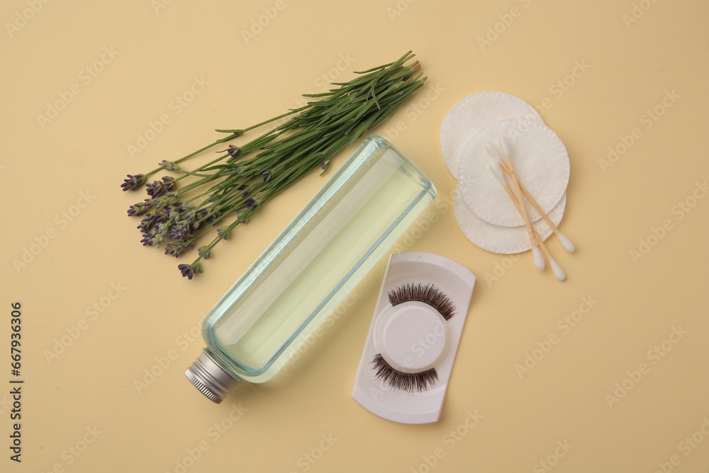 Flat lay composition with makeup remover and lavender on yellow background Flat lay composition with makeup remover and lavender on yellow background