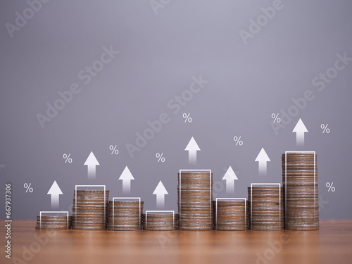Stack of coins with arrow rising icons and percentage. The concept of Financial investment, Market stock, Profit return, Dividend and Business fund.