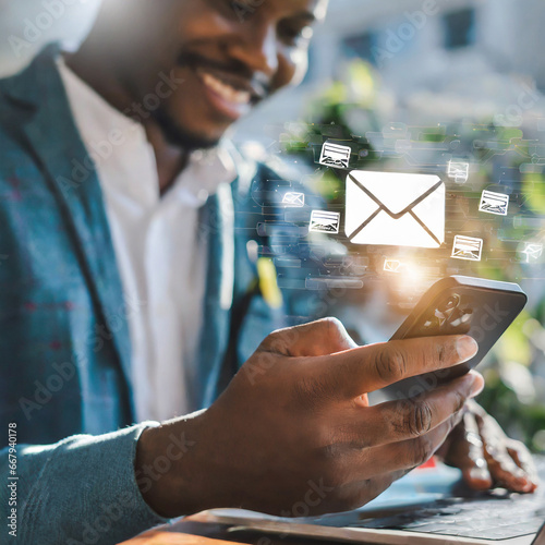 New email notification concept for business e-mail communication and digital marketing. Man using a mobile phone with sending online message with email icon. Inbox receiving electronic message aler photo