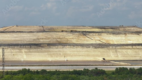 Aerial view of large open air phosphogypsum waste stack near Tampa, Florida. Potential danger of disposing byproduct of phosphate fertilizer production photo