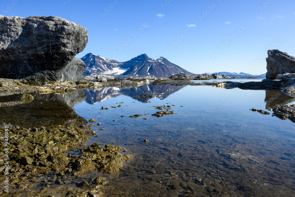Coastline peaceful landscape of Gnalodden as a nature background, arctic expedition tourism around Svalbard
