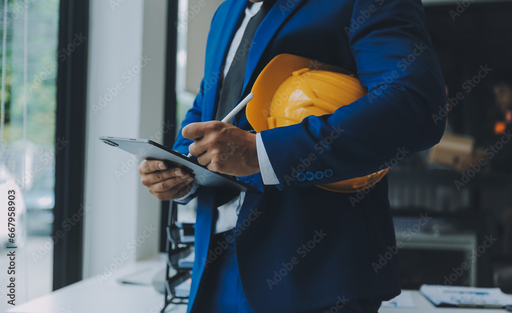 Fototapeta premium Civil Engineer Hispanic smiling with Constuction backgrounds, use for banner cover. Success in target of project goal Handsome Middle Eastern worker.