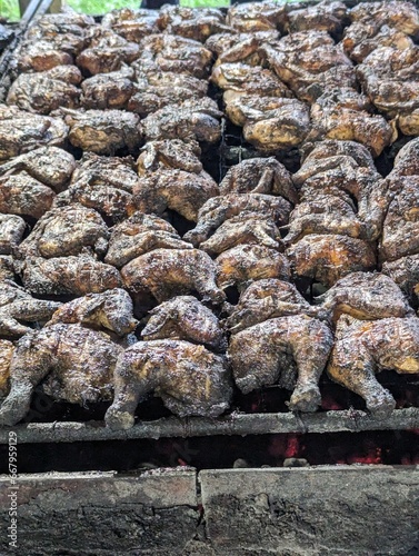 Chicken barbecuing on a grill