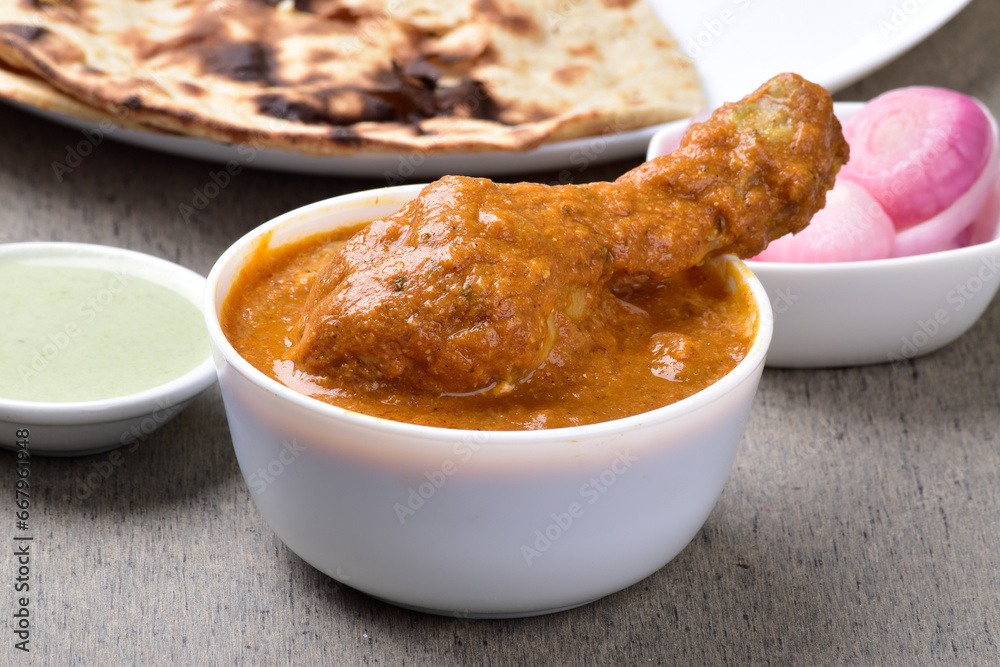 Bowl of butter chicken at dinner table