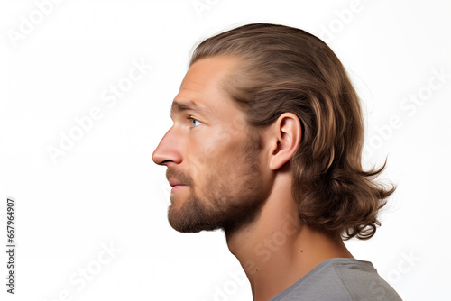 Man with Long Wavy Hair Gazing Thoughtfully to the Distance