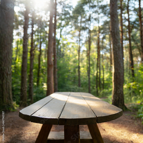 In a green forest, a wooden table stands, surrounded by tall trees blurred background. High quality photo