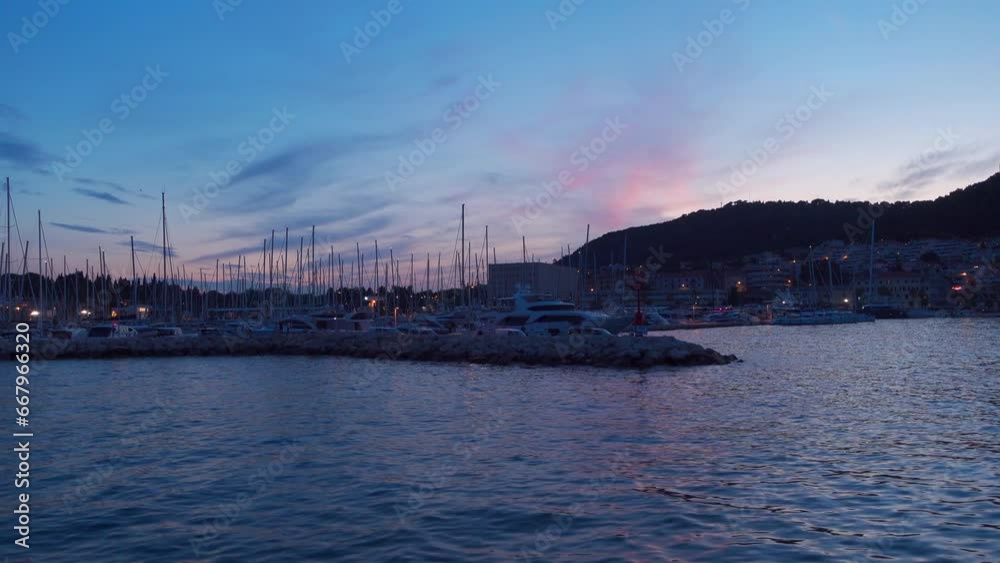 Yachts lying in Split bay during a blue-purple sunset (Croatia) Yachts lying in Split bay during a blue-purple sunset (Croatia)