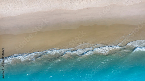 Beach Wave water in the Tropical summer beach with sandy beach background