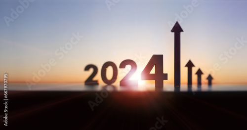 Arrows and graphs rising high, 2024 new year sunrise and bright rising sun and stock finance economic industry growth and success, investment goals and objectives concept
 photo