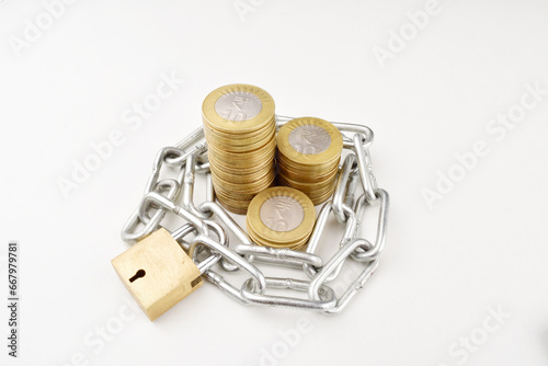 Finance security concept, coins with lock isolated on white background