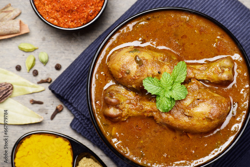 Spicy chicken curry in bowl, indian style chicken