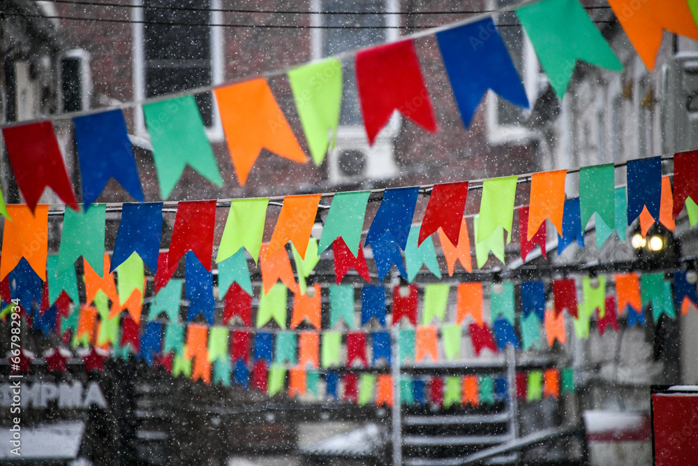 Fototapeta premium colorful flags decorate the street