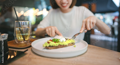 Guacamole avocado healthy food and asian woman background at indoor restaurant on day