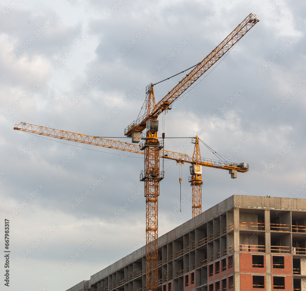 Tower crane at the construction site of a multi-story building