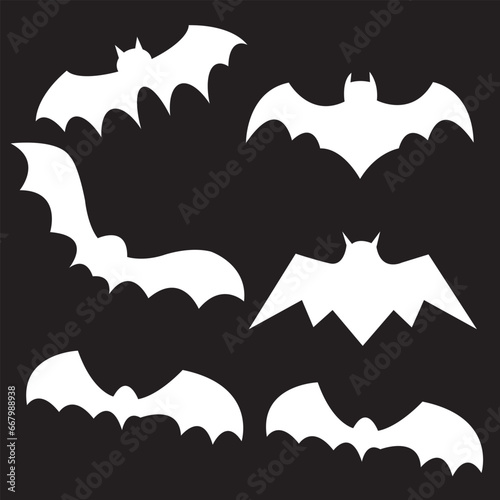 Black silhouettes of bats set on black background.