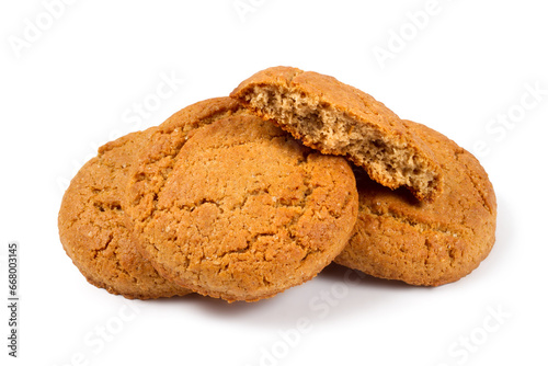 A bunch of oatmeal cookies with half a cookie. Oatmeal biscuits on a white background.