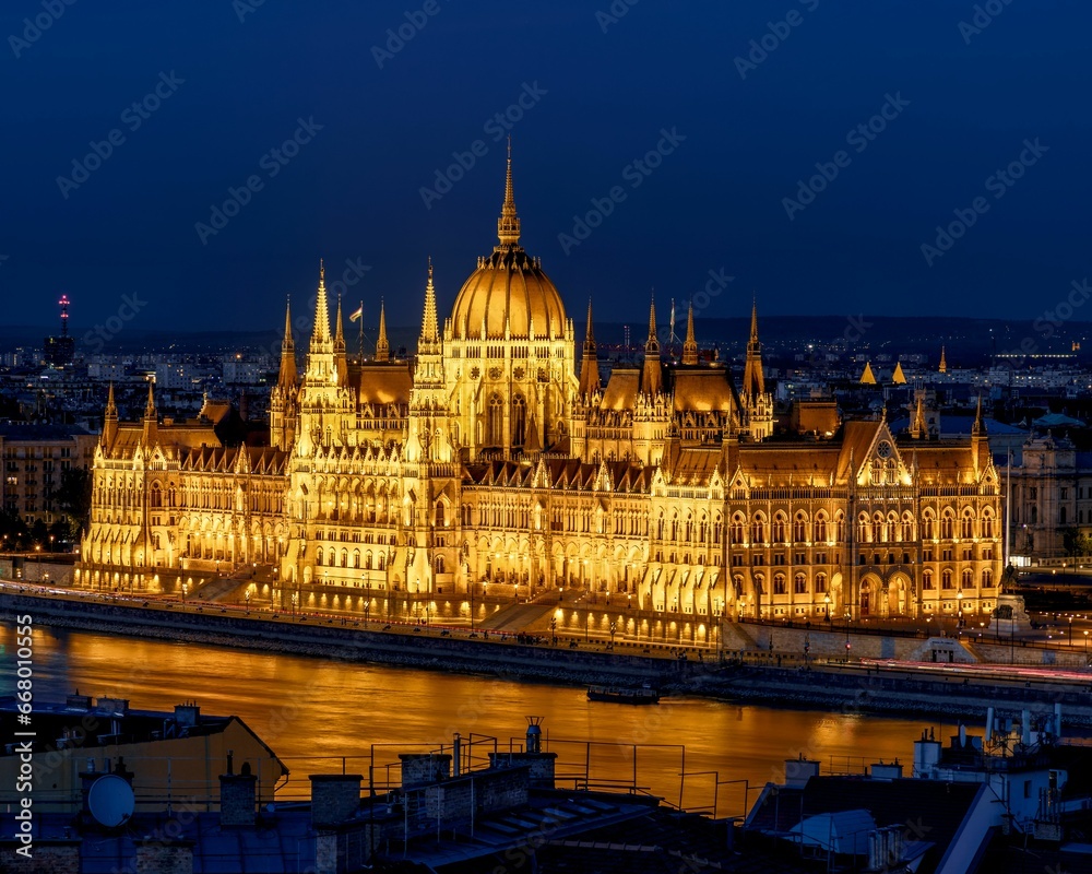 Nighttime view of the Hungarian Parliament building in Budapest illuminated against a dark sky