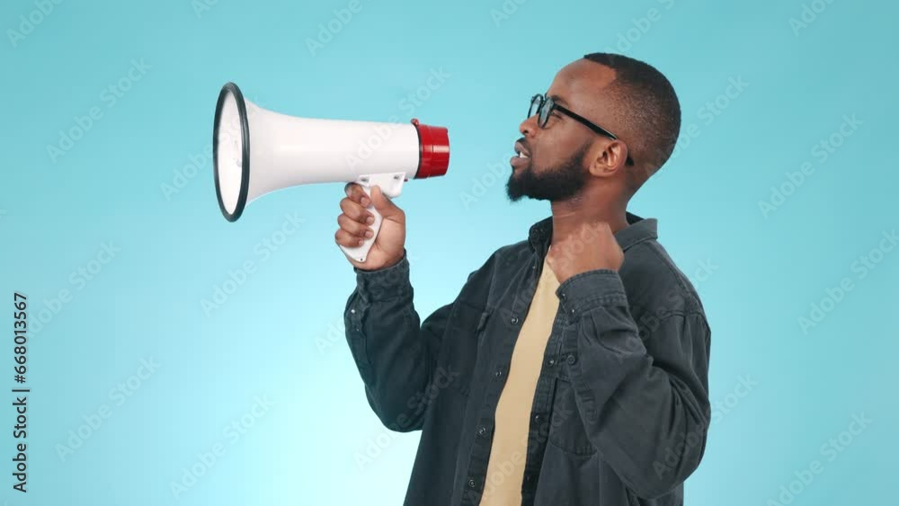 Megaphone, change or black man speaking in studio on blue background for freedom or hope. Broadcast, news announcement or African person talking on loudspeaker for human rights speech or justice Megaphone, change or black man speaking in studio on blue background for freedom or hope. Broadcast, news announcement or African person talking on loudspeaker for human rights speech or justice