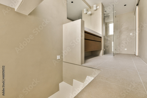an empty bathroom with no one person in the photo  taken from the top floor to the wall and ceiling