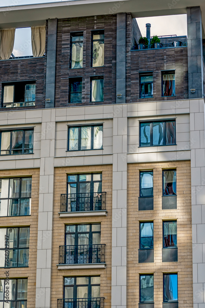Fragment of the facade of a multi-storey residential building on an autumn day Fragment of the facade of a multi-storey residential building on an autumn day