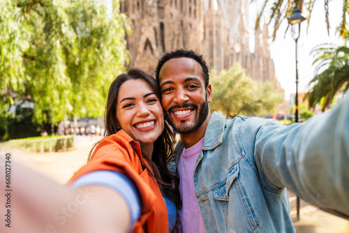 Photography Multiracial beautiful happy couple of lovers dating at Sagrada Familia, Barcelon