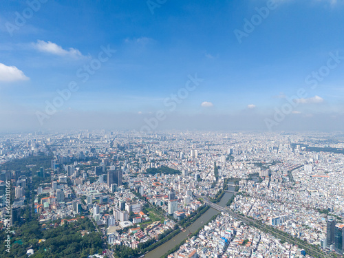 Fototapeta Naklejka Na Ścianę i Meble -  Aerial view of Ho Chi Minh City skyline and skyscrapers in center of heart business at Ho Chi Minh City downtown.