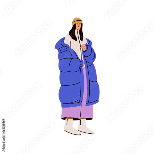 Young stylish woman in fashion winter outfit. Modern girl wearing warm puffer...