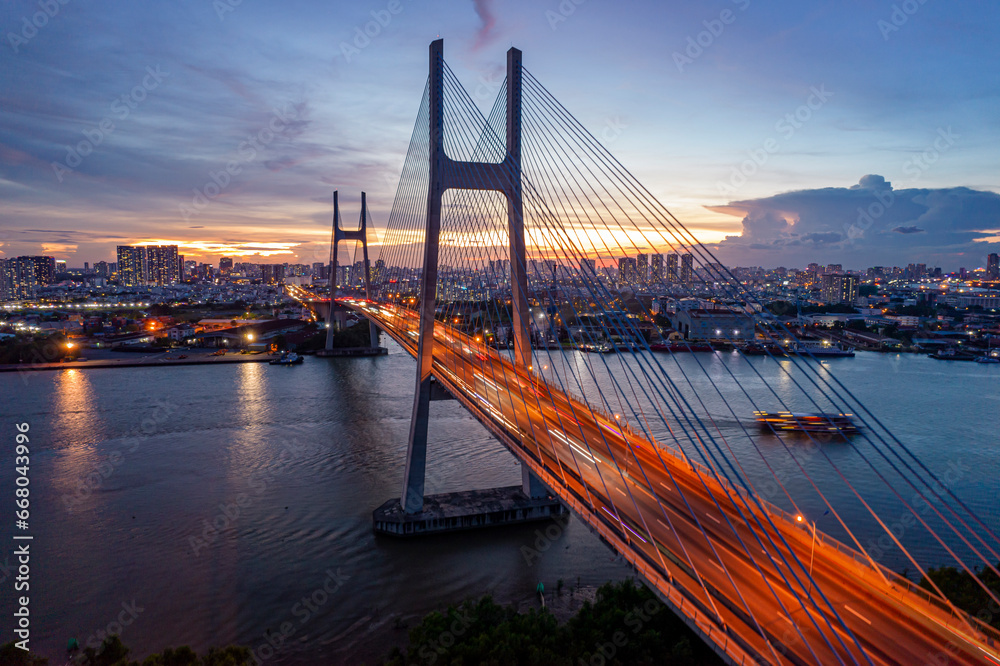 Obraz premium Sunset on Phu My bridge, Saigon riverside, Ho Chi Minh city, Vietnam.