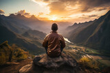 Male yogi meditating on top of a mountain