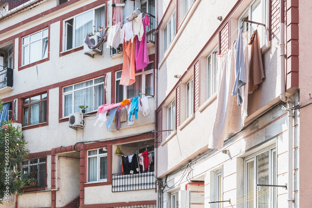 Freshly washed laundry hangs on a line under the window. Ordinary life in the city. Balconies of the Old Districts of Istanbul.