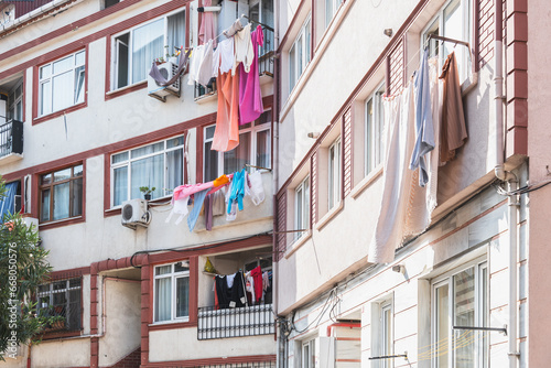 Freshly washed laundry hangs on a line under the window. Ordinary life in the city. Balconies of the Old Districts of Istanbul.