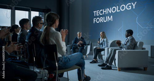 Fotografie International Technology Conference: Host Asking Caucasian Female Tech CEO a Question In Front Of Audience