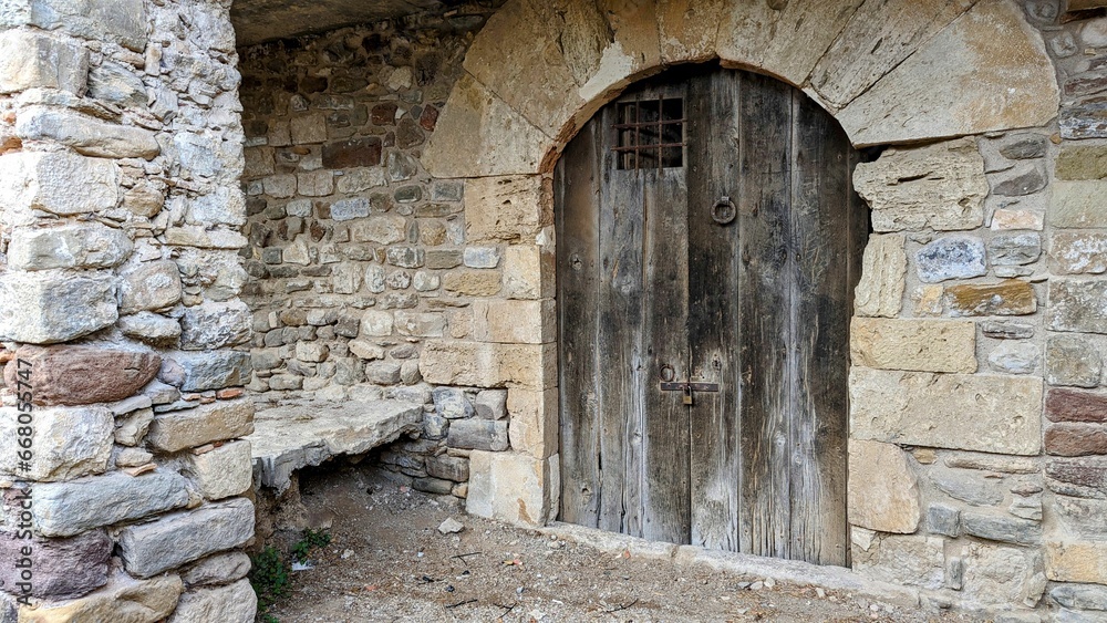 Aged stone building with a wooden door