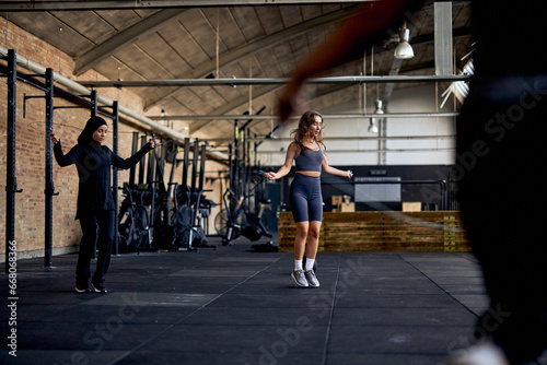 Women skipping rope during a gym class photo