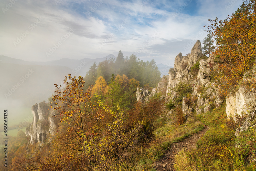 Mountain rocky landscape in autumn foggy morning. The Podskalsky Rohac hill in Strazov Mountains Protected Landscape Area, Slovakia, Europe.