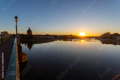 Bridge of Pont Saint-Pierre with Dôme de La Grave at sunset, Toulouse, France