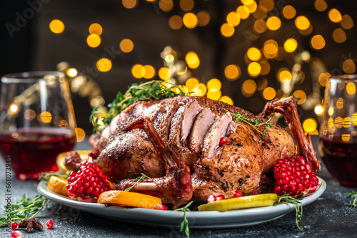 Whole roasted duck with oranges, berries and herbs. Dish for Christmas Eve. place for text