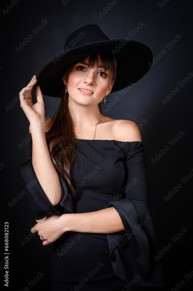 Elegant Woman in Black Hat and Off-Shoulder Dress Elegant Woman in Black Hat and Off-Shoulder Dress
