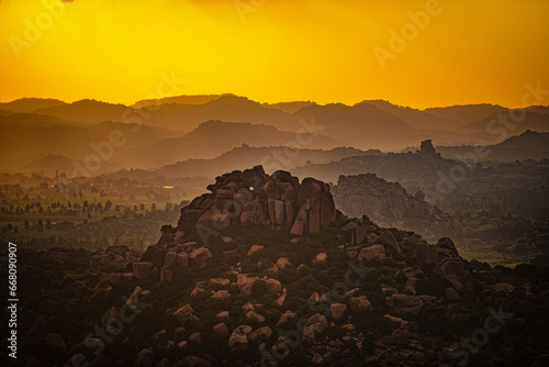 View of Matanga Hill during the sunrise in the morning in the Unesco World Heritage town in Hampi, Karnataka, India photo