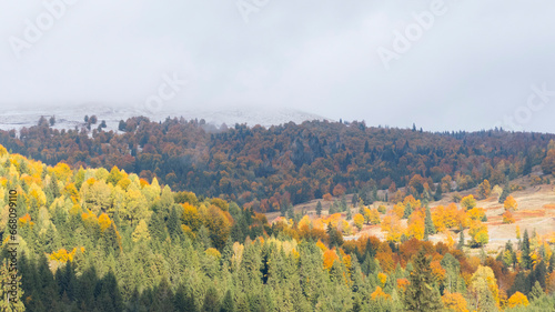 Autumn Landscape With Snow In The Mountains