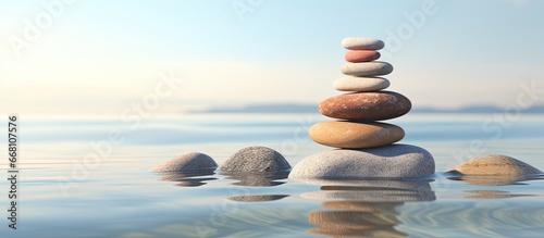 AI renders balanced pebbles against blurry ocean backdrop