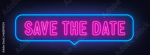 Save The Date neon sign in the speech bubble on brick wall background.