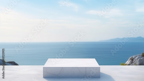 White marble podium with sea view on background.