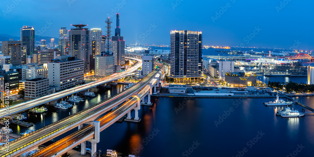 Obraz premium Kobe skyline from above with port and elevated road panorama at twilight in Japan
