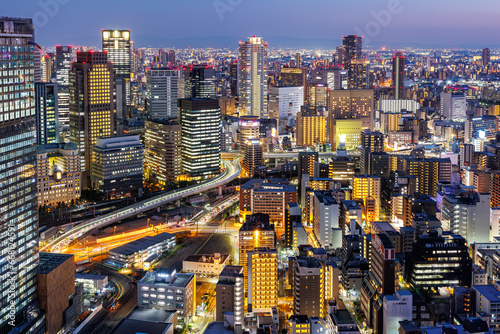 Osaka big city lights from above skyline with skyscraper at twilight in Japan © Markus Mainka
