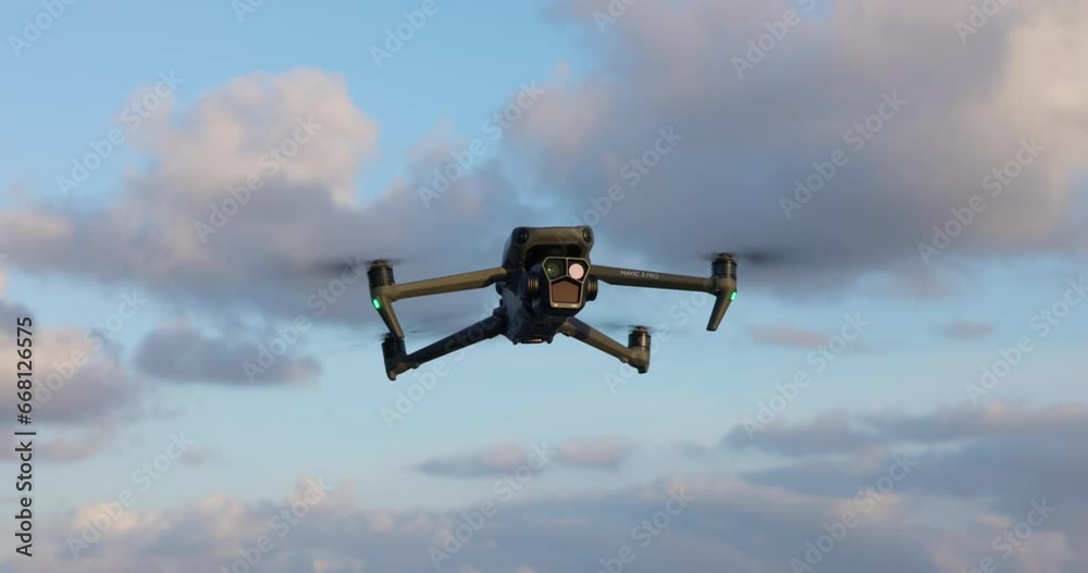 Flying DJI Mavic 3 Pro drone suspended in air Flying DJI Mavic 3 Pro drone suspended in air